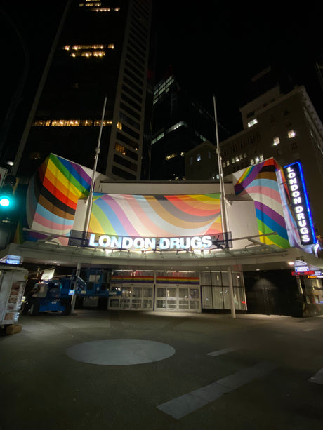Pride fabric banner on corner of Granville and Georgia street in Downtown Vancouver